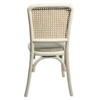 Silla Frida Tapizado de madera de pino con respaldo de bejuco sintético y asiento tapizado, apilable.