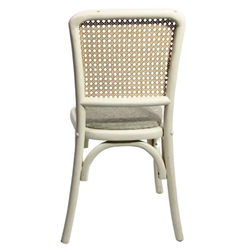 Silla Frida Tapizado de madera de pino con respaldo de bejuco sintético y asiento tapizado, apilable.